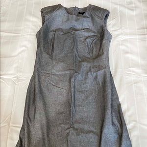 Gray business dress with shoulder detailing